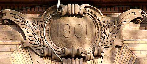 <p>A panel or tablet, often in round or oval form, often for an inscription or coat of arms.</p>