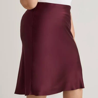 <p>her plum-coloured skirt</p>