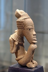 <p>Students examine a terracotta figure from the ancient Nok culture of present-day Nigeria. Why is Nok art historically important?</p>