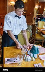 <p></p><p>The server is setting the table.</p>