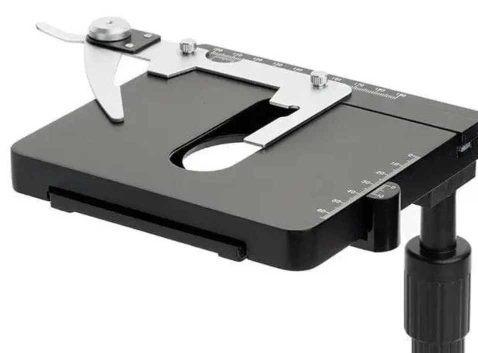 <p><span>Holds the slide in place</span></p>