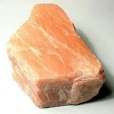 <ul><li><p>Flesh pink to light gray in color</p></li><li><p>Contains perthitic intergrowths (color markings)</p></li></ul><p></p>
