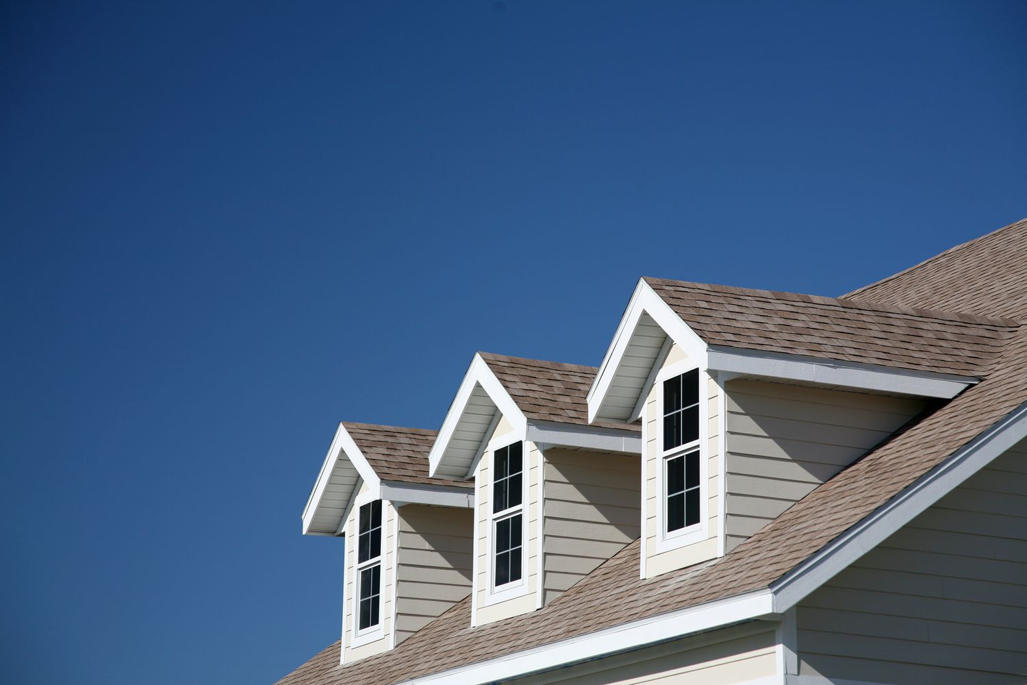 <p>A structure that projects from a sloping roof to form another roofed area. This new area is typically used to provide a surface to install a window.</p>