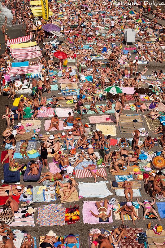 <p>The beach is <strong>overcrowded</strong> in summer — there is no space to sit.</p>