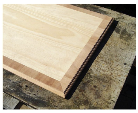 <p>Decorative border created by placing veneer grain at right angles.</p>