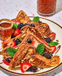 <p>Brunch dish served with a mixed berry compote &amp; fresh strawberries for $$18$$.</p>