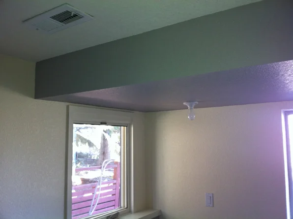 <p>A lowered ceiling, typically found in kitchens, halls, and bathrooms, typically to allow for recessed lighting, wiring, or HVAC ducts.</p>