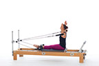 <p><strong>Setup</strong></p><ul><li><p>Starting in Biceps position (page 69), arms bent at 90 degrees and parallel to each other, shoulder height, forearms in straps, palms facing body</p></li><li><p>[ Resistance: light to medium | <strong>Springs: 1B or 1R ] > added by myself</strong></p></li></ul><p><strong>Movement</strong></p><ul><li><p>Exhale: Move arms out to sides</p></li><li><p>Inhale: Move arms forward, return to start position</p></li></ul><p><strong>Muscle Focus</strong></p><ul><li><p>Elbow flexors</p></li><li><p>Shoulder flexors</p></li><li><p>Scapular stabilizers</p></li><li><p>Spinal extensors</p></li></ul><p><strong>Objectives</strong></p><ul><li><p>Shoulder horizontal abductor strength</p></li><li><p>Shoulder flexor control</p></li><li><p>Scapular stabilization</p></li><li><p>Trunk stabilization</p></li></ul><p><strong>Cues</strong></p><ul><li><p>Move upper arms parallel to floor</p></li><li><p>Bias shoulders toward external rotation</p></li><li><p>Maintain consistent position of arms with palms facing body</p></li></ul><p></p>
