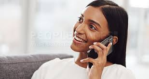 <p>The woman is talking on the phone.</p>