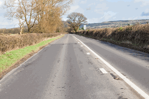 <p>You see these double white lines along the centre of the road. When may you park on the left?</p>
