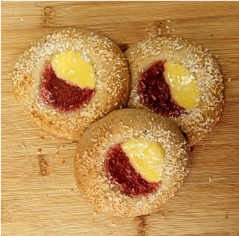 <p>Jam and pastry cream filled cardamom bun, coonut milk with coconut topping. Vegan!</p>