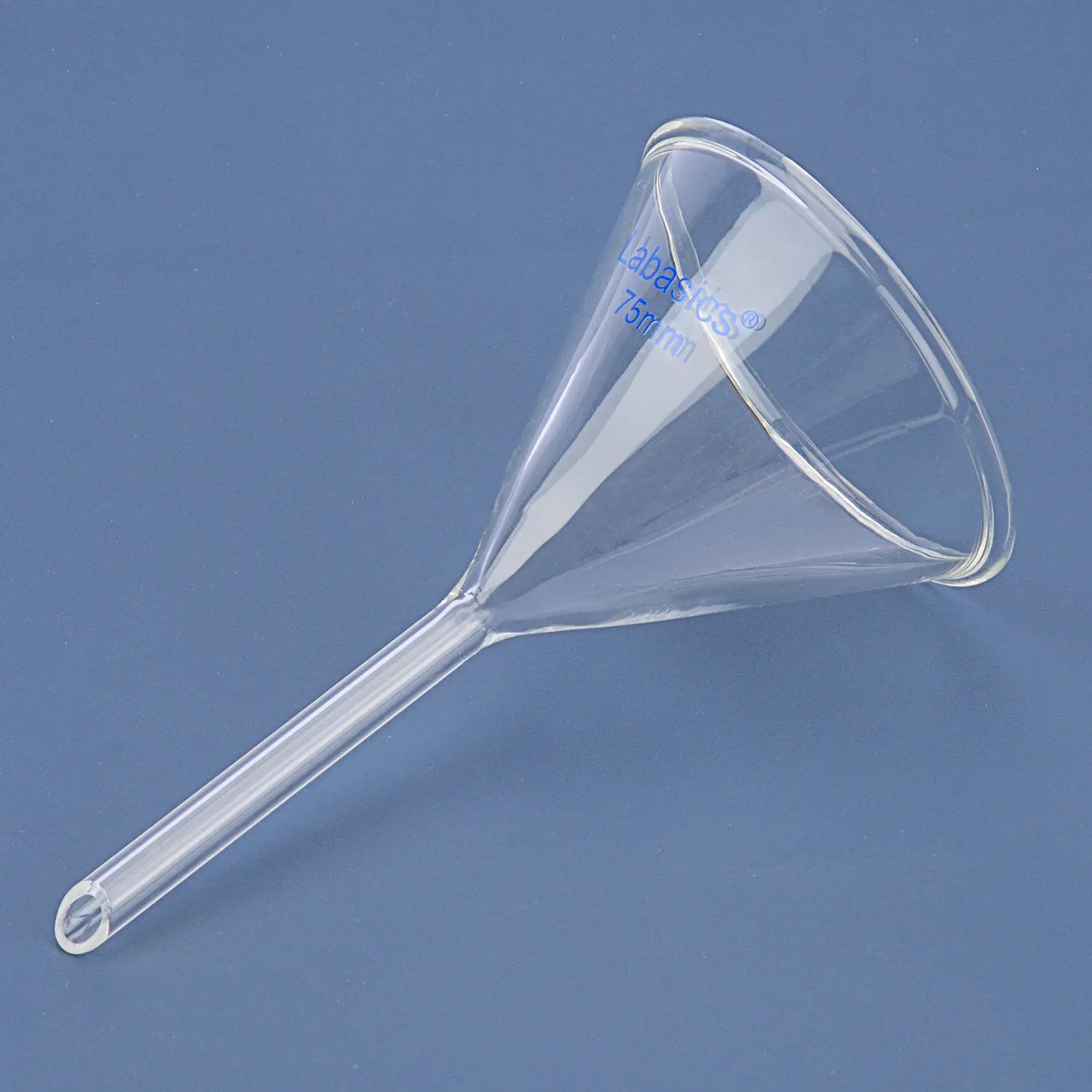 <p>A conical-shaped glass device used to channel liquids or fine-grained substances into a container, often featuring a wide mouth for easy pouring. </p>
