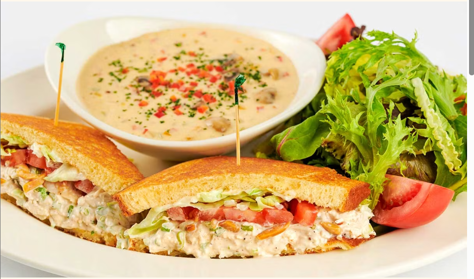 <p>One-Half of a Chicken-Almond Salad Sandwich, a Cup of Our Soup and a Small Green Salad</p>
