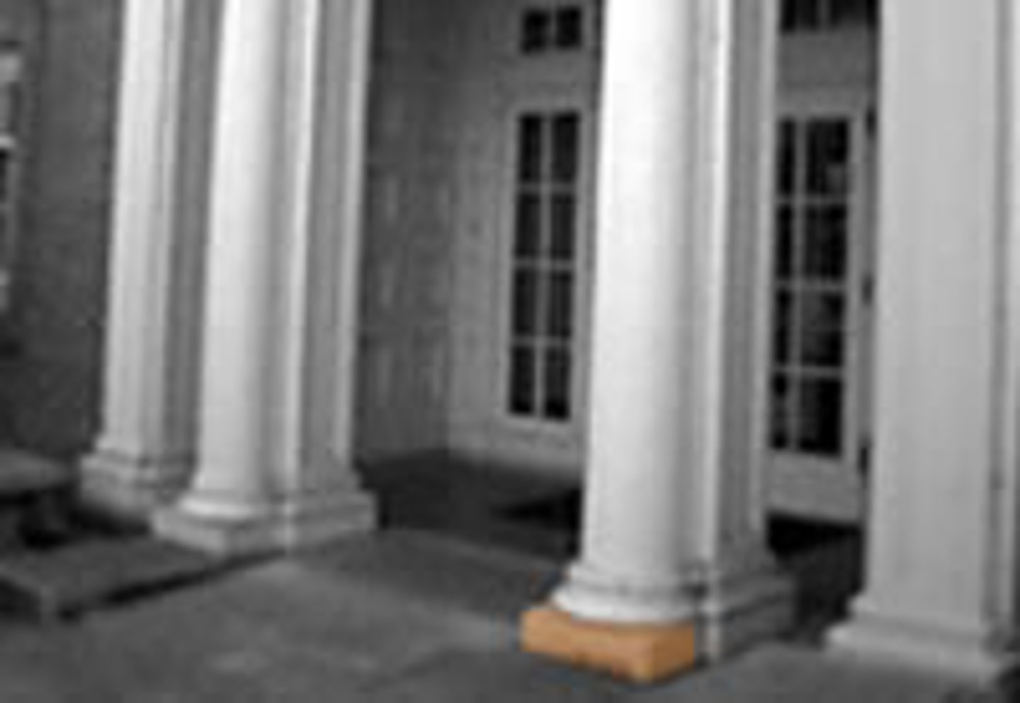 <p>Is a square slab at the bottom of a column. also a flat block at the base of a door or a wall.</p>