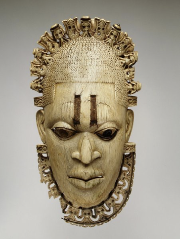 <p>Pendant Mask of Queen Mother Iyoba. Iron and Copper. Kingdom of Benin</p>