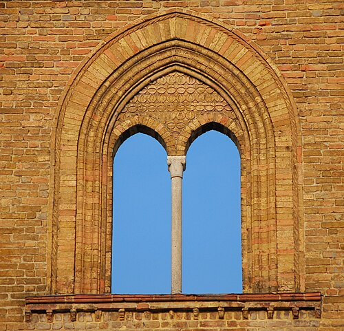 <p>a vertical element that forms a division between the units of a window, door, or screen, or that is used decoratively</p>