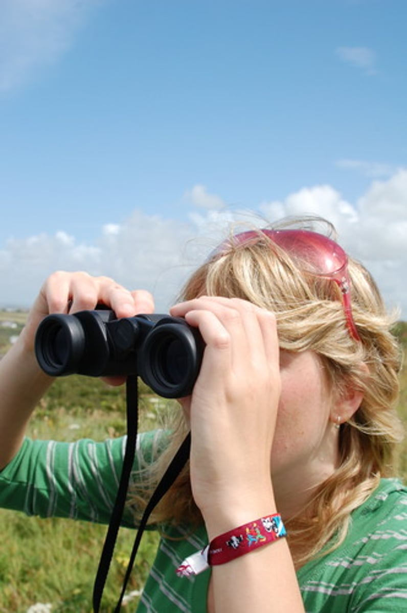 <p>hidden from or out of the range of vision</p>