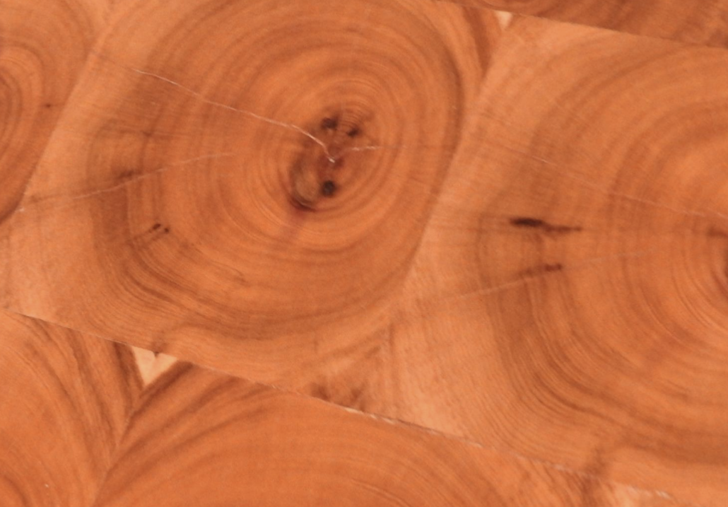 <p>Decorative veneer technique using circular wood grain patterns.</p>