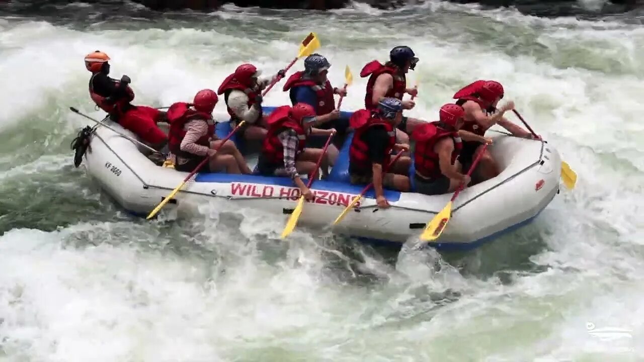 <p>Travelling down rough rivers in an inflatable raft</p>