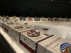<p>The Dinner Party is a monumental installation artwork by American rtist Judy Chicago. It celebrates women's history and achievements through an elaborately designed ceremonial banquet. Which of the below best describes this art work?</p>