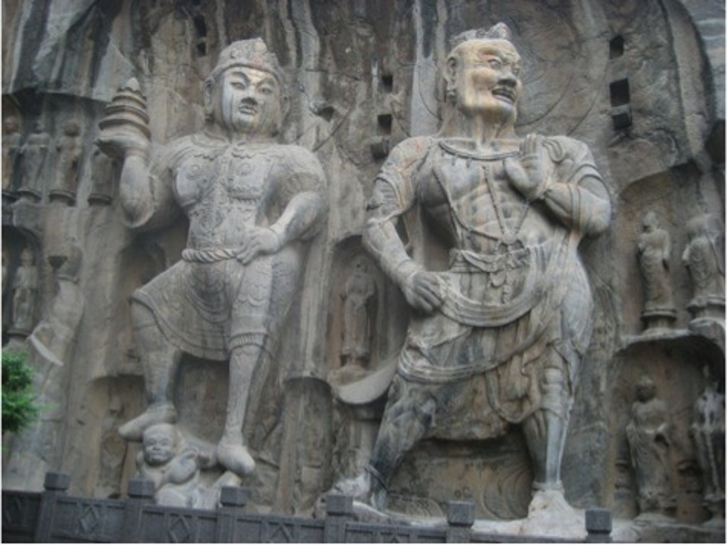 <p>Buddhist guardian figures, highly muscular, with thunderbolts</p>