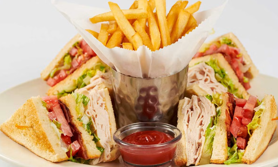 <p>Freshly Roasted Turkey Breast, Bacon, Lettuce, Tomato and Mayonnaise on White Toast</p>