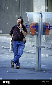 <p>The man is calling from a public phone.</p>