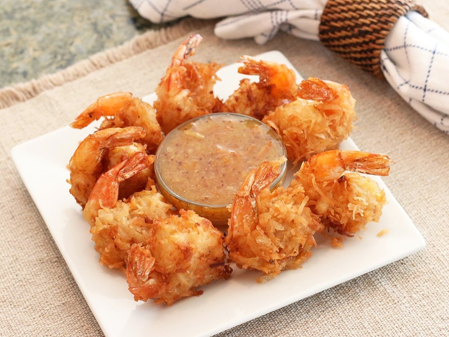 <p>8 large shrimp (6 at lunch), hand-dipped in beer batter, rolled in coconut and fried golden. Paired with a creole marmalade.</p>