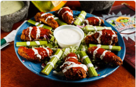 <p>(8) Buffalo wings served with celery and ranch.</p>