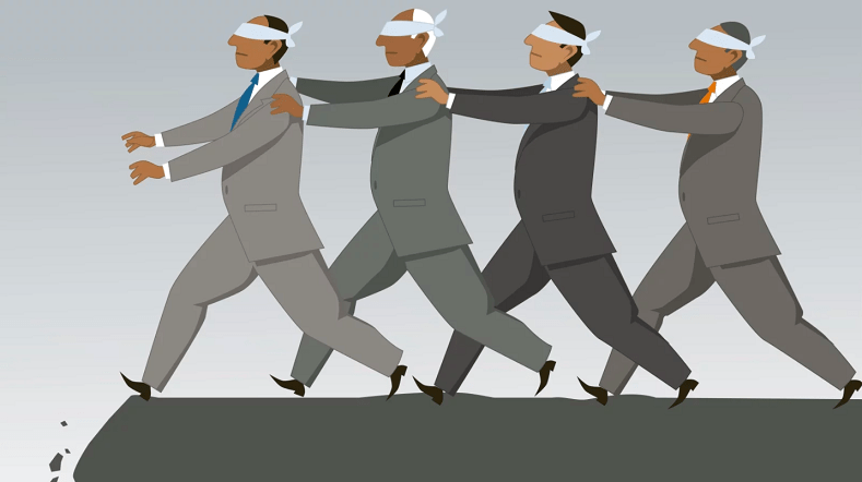<p>When a group doesn’t use critical thinking skills and follows the leader, both positive and negative</p>