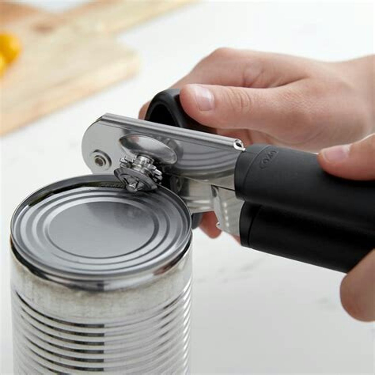 <p>A tool used for opening metal cans of food.</p><p>Example: I need a can opener to open this tin of beans.</p>