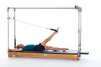 <p><strong>Setup</strong></p><ul><li><p>Lying supine in neutral spine position, legs parallel, one leg perpendicular to mat, one foot in strap, plantarflexed, other leg placed on mat, leg straight, foot plantarflexed, hands holding F2 Handles, arms bent at 90 degrees in elbow and shoulder joint or arms straight overhead, holding poles, thumbs wrapped around</p></li><li><p>Socket: F, Lever Orientation: 0, Lever Length: 1, Lever Direction: 2, Connector:N/A, Spring: N/A</p></li><li><p>Resistance: light to medium</p></li></ul><p><strong>Movement</strong></p><ul><li><p>Exhale: Open leg out to side, circle leg around and together</p></li><li><p>Inhale: Lift leg, return to start position</p></li></ul><p><strong>Muscle Focus</strong></p><ul><li><p>Hip extensors</p></li><li><p>Hip adductors</p></li><li><p>Spinal flexors</p></li><li><p>Spinal extensors</p></li></ul><p><strong>Objectives</strong></p><ul><li><p>Hip extensor strength</p></li><li><p>Hip adductor control</p></li><li><p>Pelvic lumbar stabilization</p></li></ul><p><strong>Cues</strong></p><ul><li><p>Maximize hip disassociation</p></li><li><p>Maintain pelvic lumbar stabilization</p></li><li><p>Draw straight line up center</p></li><li><p>Draw semi-circle as leg circles out, around and up</p></li><li><p>Keep supporting leg elongated and stable</p></li></ul><p></p>
