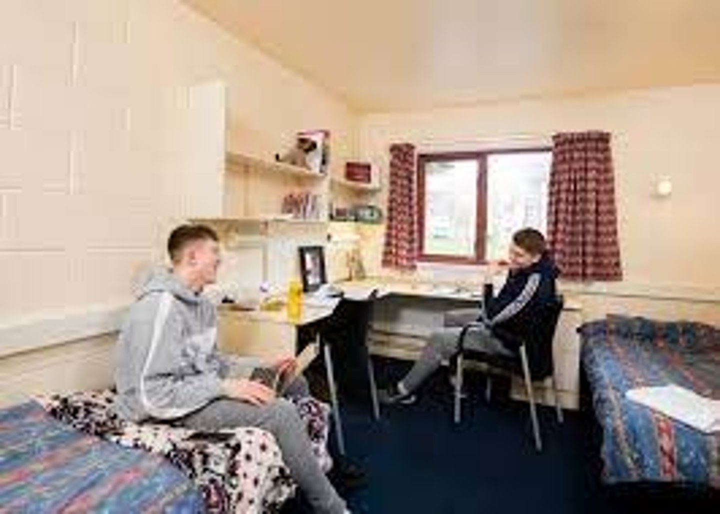 <p>(noun) housing provided for students. They are often called dorms.</p>