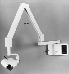 <p>**Metal encasement enclosing x-ray tube, transformers, and oil</p><p>- Electrical cables inside supporting arm</p><p>- Supporting arm and yoke enable the tube head to be positioned around the patient's head</p>