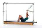 <p><strong>Setup</strong></p><ul><li><p>Lying supine in neutral spine position, legs bent and parallel, feet hip width apart, arms straight and shoulder width apart, hands holding PTBar, lift to Chest Lift position (Mat page 17), shoulders under PTBar</p></li><li><p>Resistance: light to medium <strong>[Top loaded] 2 springs</strong></p></li></ul><p><strong>Movement</strong></p><ul><li><p>Exhale: Lift trunk</p></li><li><p>Inhale: Lower trunk, return to start position</p></li><li><p>Final Exhale: Lower trunk to supine position</p></li></ul><p><strong>Muscle Focus</strong></p><ul><li><p>Spinal Flexors</p></li><li><p>Shoulder flexors</p></li></ul><p><strong>Objectives</strong></p><ul><li><p>Spinal flexor strength</p></li><li><p>Pelvic lumbar stabilization</p></li></ul><p><strong>Cues</strong></p><ul><li><p>Maintain C curve position while lifting and lowering</p></li><li><p>Minimize use of arms</p></li><li><p>Maintain pelvic lumbar stabilization</p></li></ul><p></p>