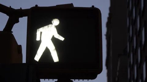 <p>What do you do when a steady WALK or walking person comes on?</p>