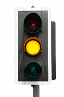 You see this amber traffic light ahead. Which light, or lights, will come on next?