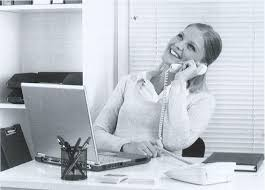 <p>The woman is conducting a phone conversation.</p>