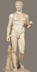 <p>Form:</p><p>-marble (Roman); bronze (Greek)</p><p>-contrapposto: shifted weight</p><p>-not meant to portray a specific person but rather specific characteristics of a Greek</p><p>Function:</p><p>-portray the physical perfection of a human figure</p><p>Content:</p><p>-everyone is imperfect but brings together different body proportions to make physical</p><p>-missing its spear</p><p>-athlete and warrior</p><p>-gazes off in the distance</p><p>Context:</p><p>-Artist= Polykleitos of Argos in 450 BCE </p><p>-Roman copy of the Greek original</p>