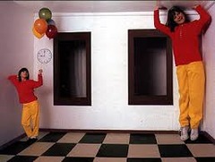 <p>A perceptual misinterpretation involving a trapezium shaped room which appears rectangular when viewed through a peephole using only one eye and people appear small or large, depending on where they stand in the room.</p>