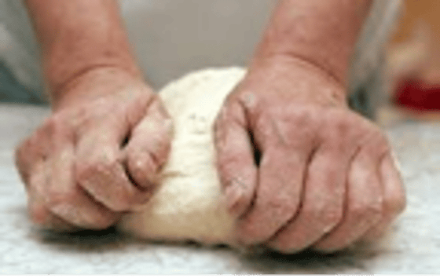 <p>to work dough with hands until it is of desired elasticity and consistency</p>
