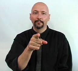 <p>Point at other person.</p>