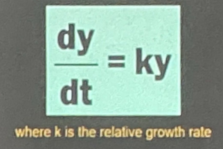 <p>"The rate of change of y is proportional to the present value of y."</p>