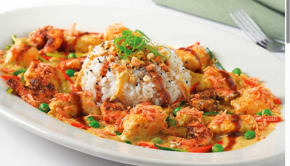 <p>A Spicy Thai Dish with the Flavors of Curry, Peanut, Chile and Coconut. Sauteed with Vegetables and Served over Steamed White Rice</p>
