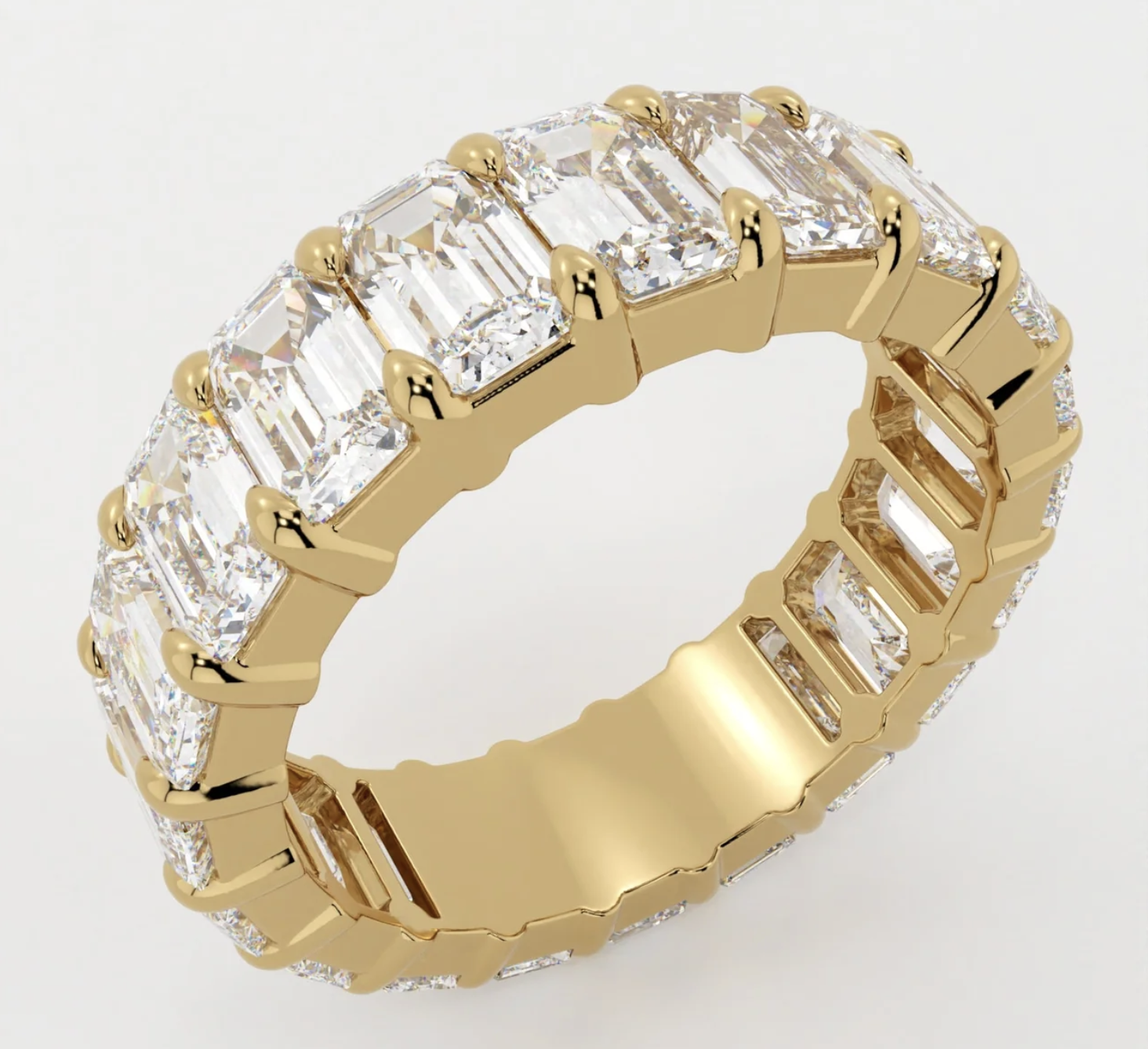 <p>Shared CLAW prongs eternity band for all fancy cuts (shown: emeralds) like radiants, cushions, ovals</p>
