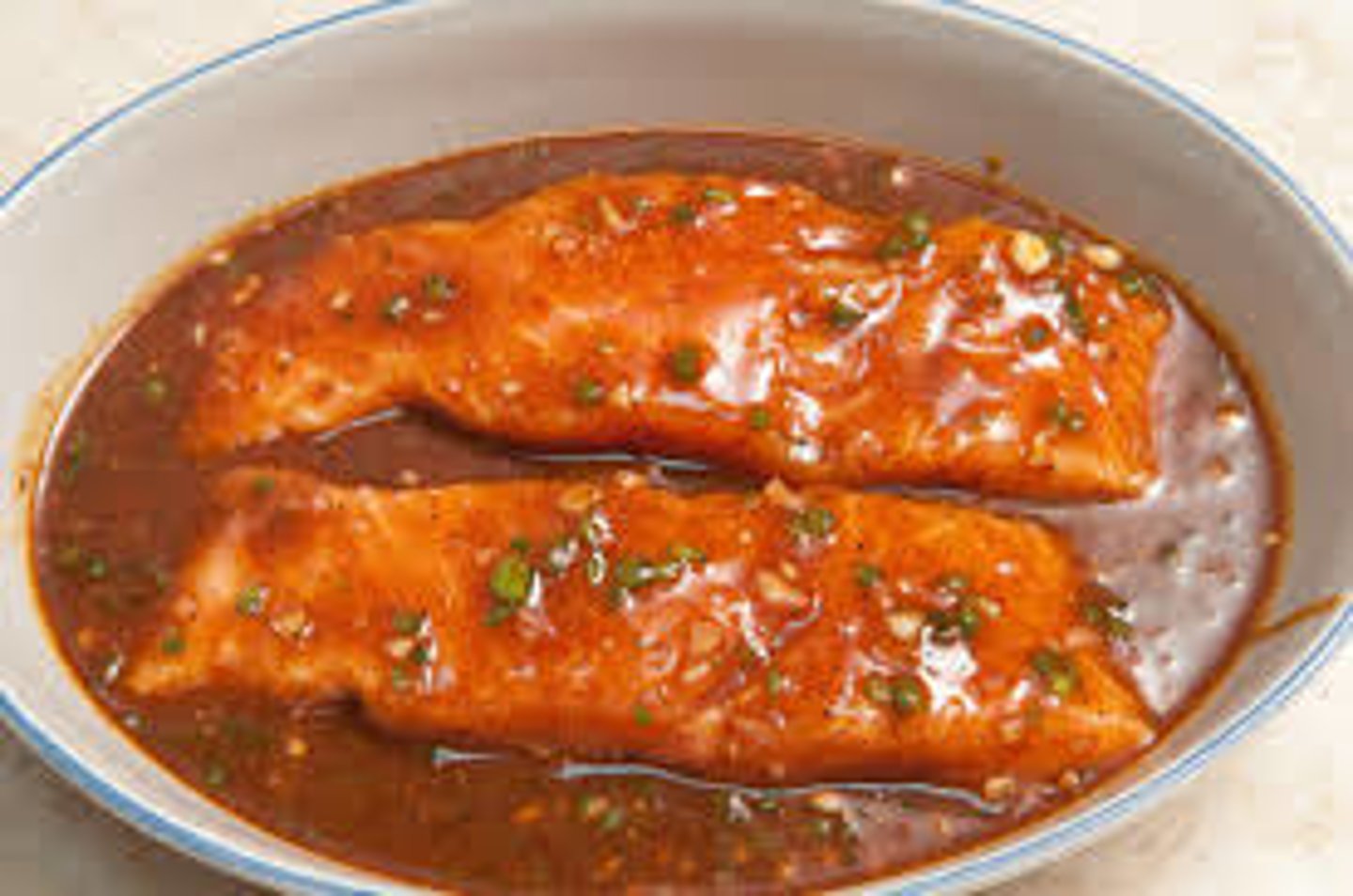 <p>To soak food in a sauce before cooking</p>