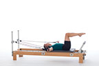 <p><strong>Setup</strong></p><ul><li><p>Starting in Extension Position (page 63) with arms out to sides in T position, hands in straps, palms facing body</p></li><li><p>Resistance: light to medium | <strong>Springs: 1B  or 1R</strong></p></li></ul><p><strong>Movement</strong></p><ul><li><p>Exhale: Move arms to sides of body</p></li><li><p>Inhale: Move arms away from body, return to start position</p></li></ul><p><strong>Muscle Focus</strong></p><ul><li><p>Shoulder adductors</p></li><li><p>Scapular stabilizers</p></li><li><p>Spinal flexors</p></li><li><p>Hip flexors</p></li></ul><p><strong>Objectives</strong></p><ul><li><p>Shoulder adductor control</p></li><li><p>Scapular stabilization</p></li><li><p>Trunk stabilization</p></li></ul><p><strong>Cues</strong></p><ul><li><p>Maintain scapular stabilization</p></li><li><p>Maintain micro-bend in elbows</p></li><li><p>Keep trunk and legs stable</p></li><li><p>Move arms along horizontal line, parallel to floor</p></li></ul><p></p>