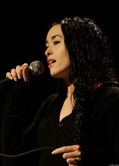 <p>to sing or hum in a soft, soothing voice</p>