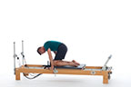 <p><strong>Setup</strong></p><ul><li><p>Kneeling on carriage, quadruped position, knees slightly away from shoulder rests, arms straight, hands placed on F2 handles (or rails), shoulders slightly forward of hands, trunk in C curve position</p></li><li><p>Resistance: light | <strong>Springs:&nbsp;1R</strong></p></li></ul><p><strong>Movement</strong></p><ul><li><p>Exhale: Move legs forward</p></li><li><p>Inhale: Move legs back, return to start position</p></li></ul><p><strong>Muscle Focus</strong></p><ul><li><p>Spinal flexors</p></li><li><p>Hip flexors</p></li><li><p>Scapular stabilizers</p></li></ul><p><strong>Objectives</strong></p><ul><li><p>Spinal flexor strength</p></li><li><p>Hip flexor strength</p></li><li><p>Pelvic lumbar stabilization</p></li><li><p>Scapular stabilization</p></li></ul><p><strong>Cues</strong></p><ul><li><p>Maintain C curve position</p></li><li><p>Focus on hip disassociation</p></li><li><p>Move knees toward chest</p></li><li><p>Engage shoulder extensors as knees move forward</p></li></ul><p></p>