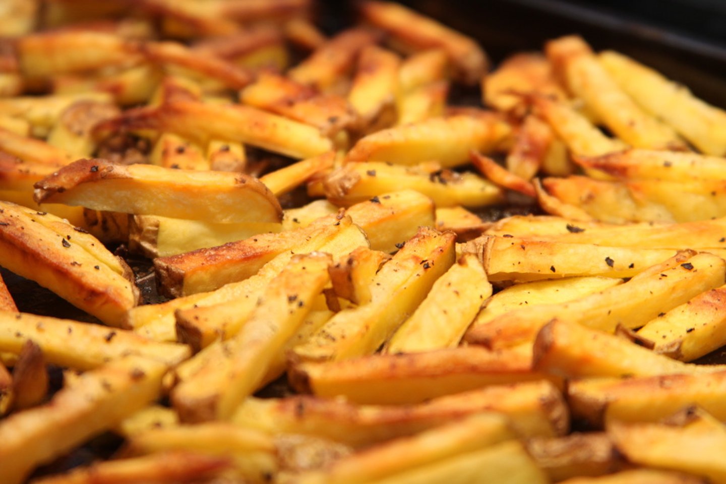 <p>To cook in hot fat or oil not deep enough to cover until brown and tender</p>
